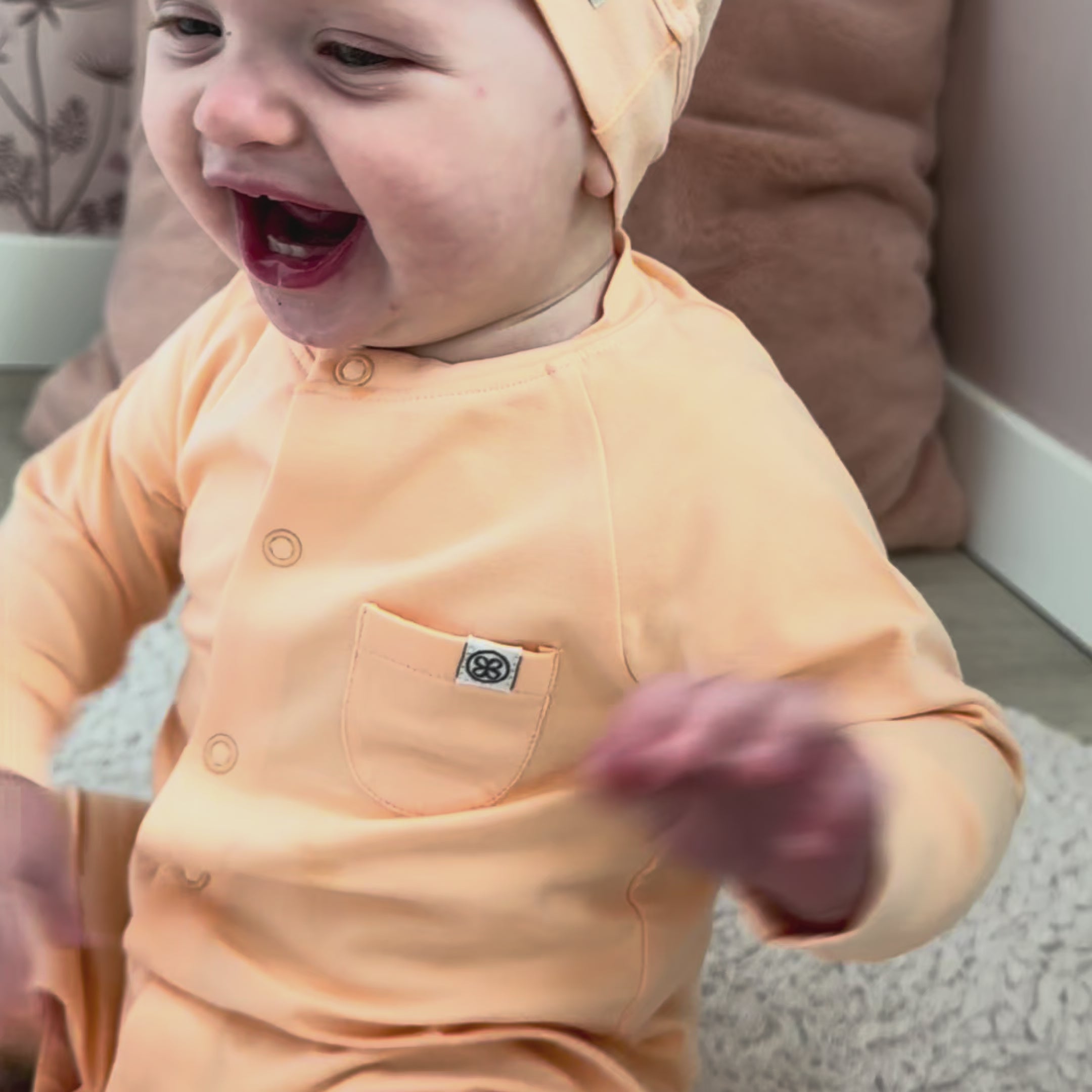 Load video: Baby playsuit in Peachy Summer - UPF 50+